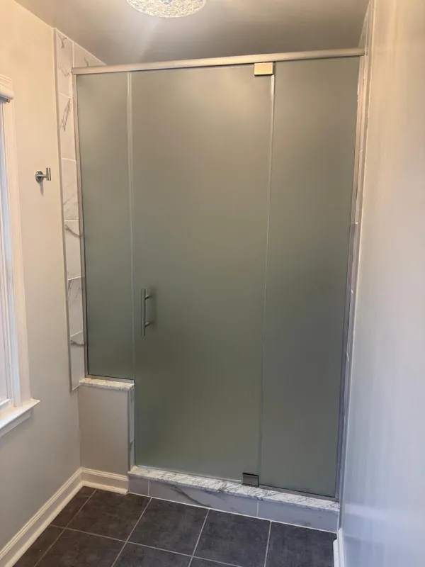 Framed frosted glass shower door